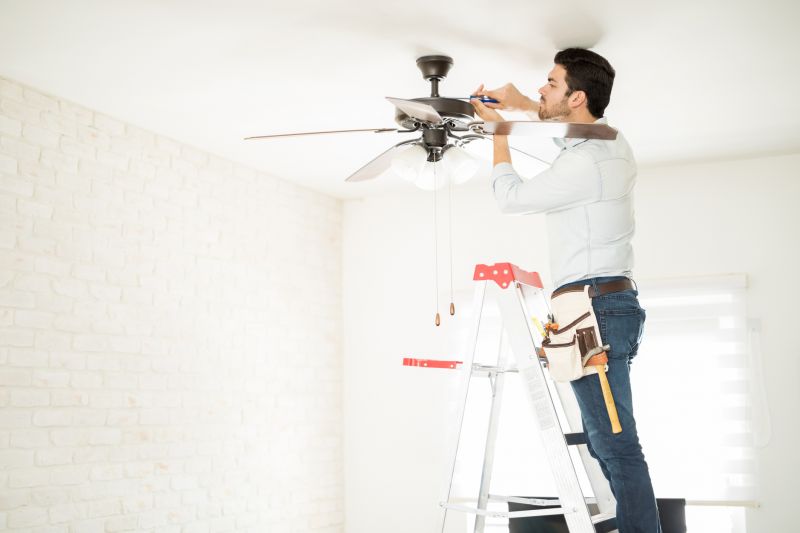 Handyman installing a ceiling fan